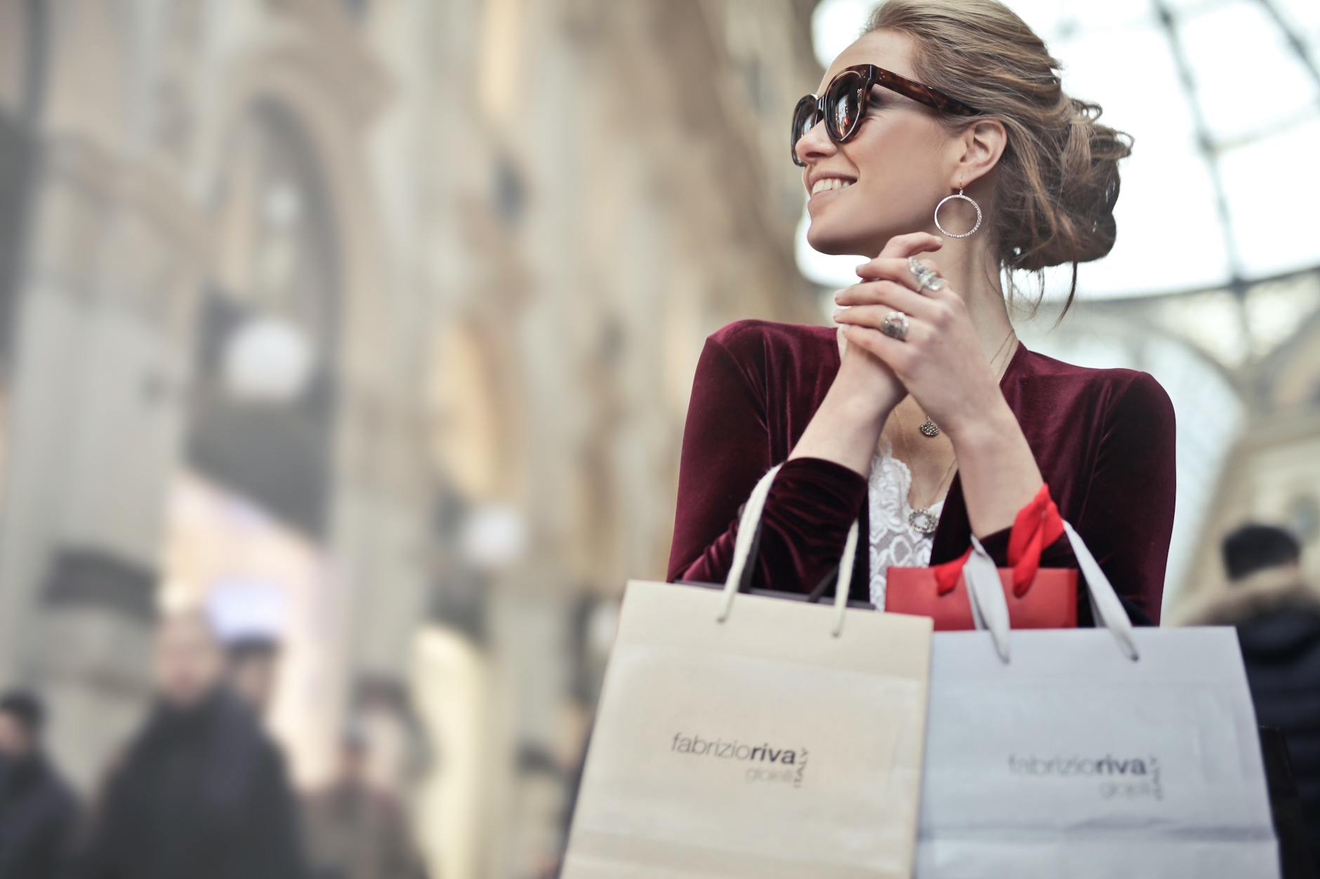 photo of a woman holding shopping bags